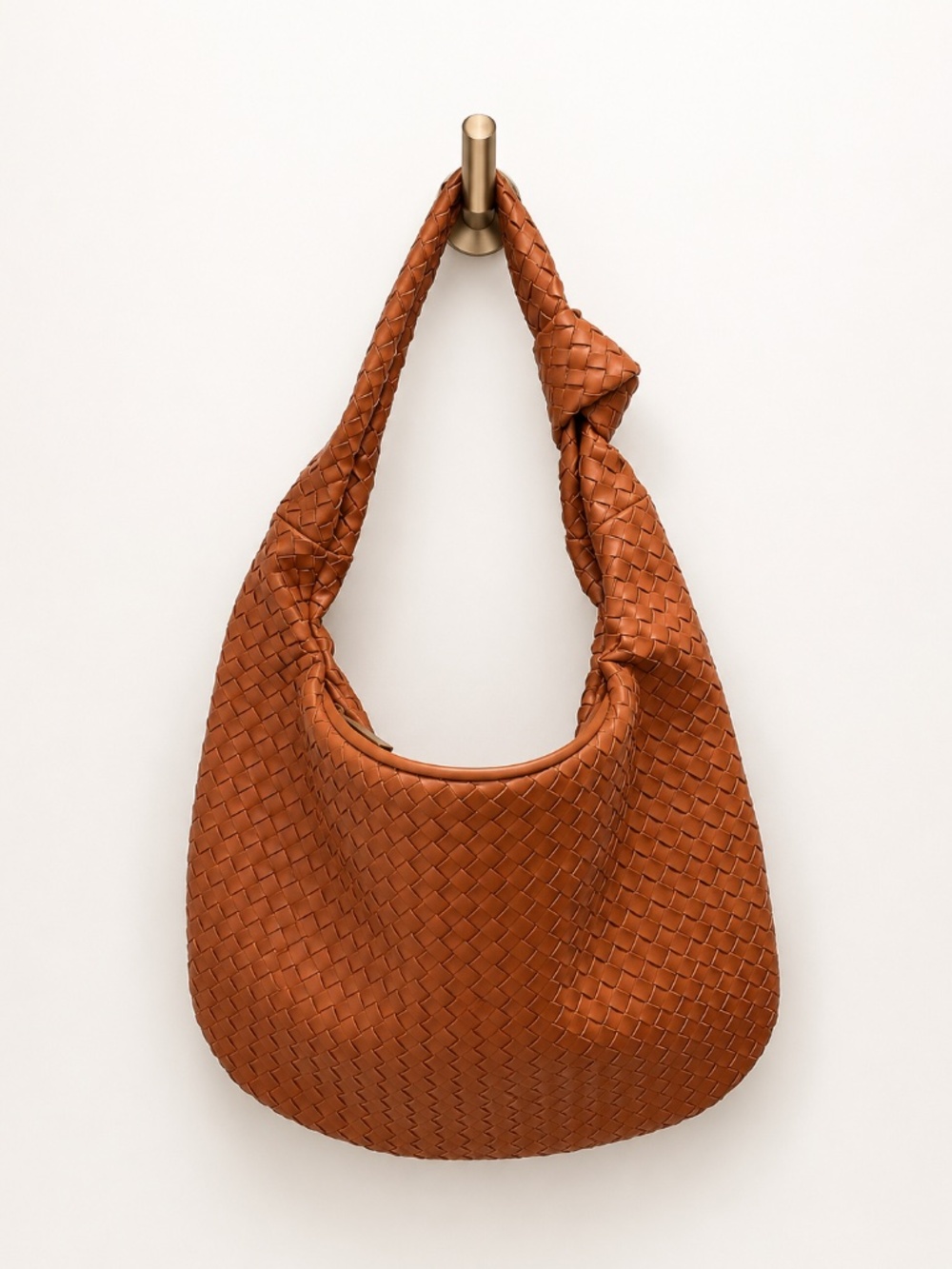 Iman Global caramel brown braided faux leather shoulder bag.
